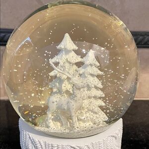 Elegant White Lighted Snow Globe with Deer and Trees makes a winter nightlight.